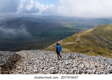 Woman Hiking Down Croagh Patrick, County Mayo, Ireland