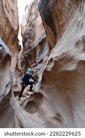 a woman hiking the Dry Fork Slot Canyon at the Lower trailhead, Hole in the Rock road in Utah Grand Staircase Escalante National Monument, America - Shutterstock ID 2282229625