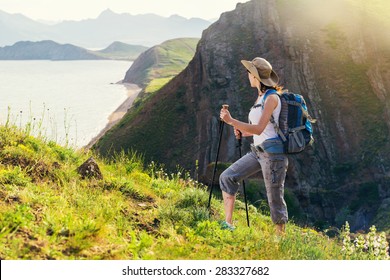 Woman Hiking. Hike In The Mountains. Woman Traveler With Backpack On Beautiful Summer Landscape.  