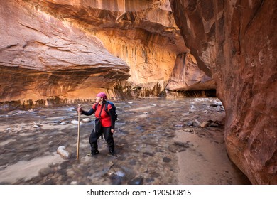 Woman Hiking The Narrows In Zion National Park, Utah