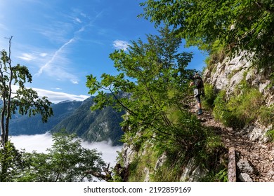 Woman hiking on a steep and impressive path, near the top of Triglav Lakes valley, Triglav national park, Slovenia - Shutterstock ID 2192859169