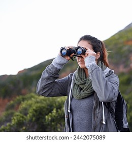 Woman, hiking and outdoor in nature with binoculars for vision for fitness, location and memory on adventure. Girl, person and trekking in bush, mountains and scenic view on vacation in Cape Town - Powered by Shutterstock