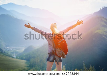 Woman hiking outdoors. Eco Tourism