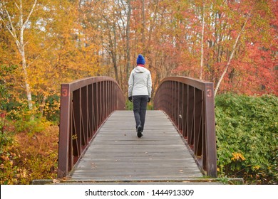 Woman Hiking At Stowe Recreation Path On Autumn Day In Vermont, USA.