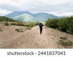 Woman hiking the Valley of Ten Thousand Smokes. Katmai National Park and Preserve. Alaska. USA.
