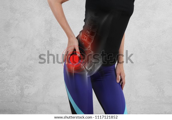 Woman with\
hip joint pain. Sport exercising\
injury