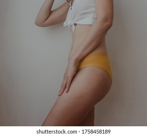woman hips in yellow lingerie - Shutterstock ID 1758458189