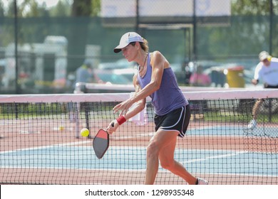 A Woman Hits A Pickleball Shot