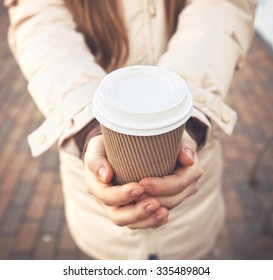 Woman Hold Cup Of Coffee On Stree