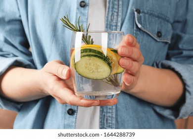 Woman Hold Glass With Cucumber Water, Front View