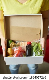 Woman Hold In Hand  Food Box Meal Kit Of Fresh Ingredients Order From A Meal Kit Company, Delivered, Cooking At Home.