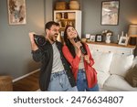 Woman hold microphone and sing, man hold loudspeaker karaoke party