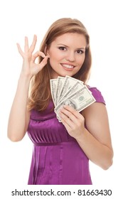 Woman holding 500 dollars and showing sign OK isolated on white background