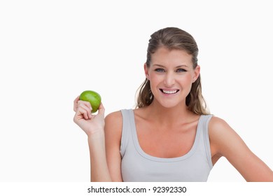 Woman holding an apple against a white background