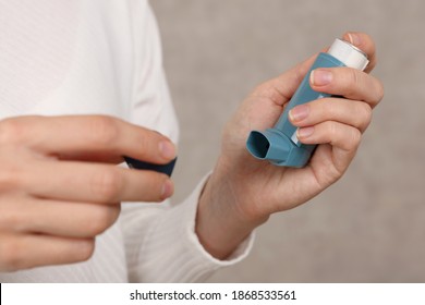 Woman Holding Asthma Inhaler Close Up