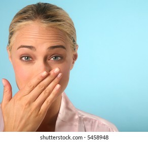 Woman Holding Back A Sneeze With Hand Over Nose