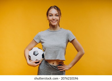 Woman Holding Ball Isolated In Studio