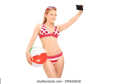 Woman Holding A Beach Ball And Taking Selfie Isolated On White Background