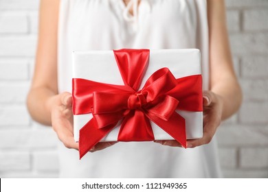 Woman Holding Beautiful Gift Box, Closeup