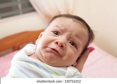 Woman Holding A Beautiful Sweet Hispanic Newborn Crying 