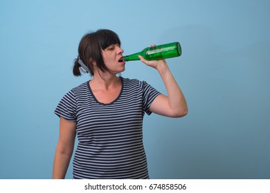 woman holding a beer bottle