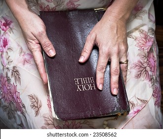 Woman Holding A Bible In Her Lap