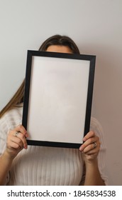 Woman Holding Black Photo Frame With White Background