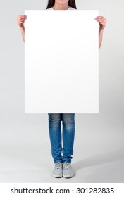 Woman holding a blank  A1 poster