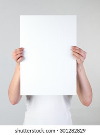 Woman Holding A Blank A3 Poster