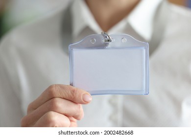 Woman holding blank badge in hand closeup - Shutterstock ID 2002482668