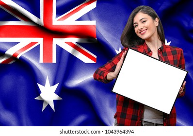 Woman Holding Blank Board Against National Flag Of Australia