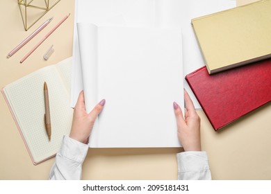 Woman Holding Blank Magazine And Books On Light Background