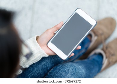 Woman Holding The Blank Screen Of Mobile Phone