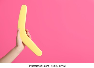 Woman Holding Boomerang On Pink Background, Closeup. Space For Text