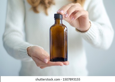 Woman Holding Bottle Syrup In Hand Medicine Healthy On White Background Isolation