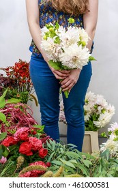 Woman Holding Bouquet Of White Dahlia Flowers.