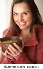 Woman Holding Bowl Of Soup