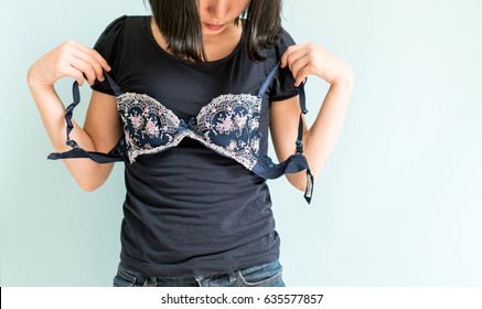 Woman holding a bra