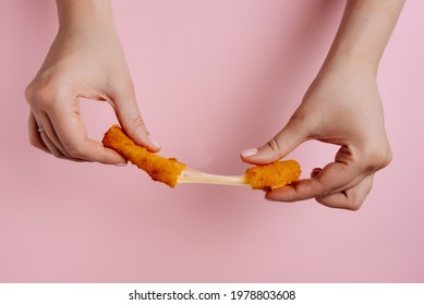 Woman Holding A Broken Cheese Stick, Close