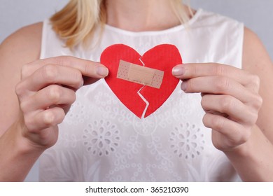 Woman Holding  Broken Heart Fixed By Plaster Close Up. Feelings And Emotions. Love Problems, Second Chance,hope, Feelings And Emotions Concept