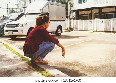 Woman Holding A Car Key, Vacantly Searching For Her Car In A Public Parking Area, Has Been Stolen, Leaving Only Empty Space : Car Theft Concept, Lost Car