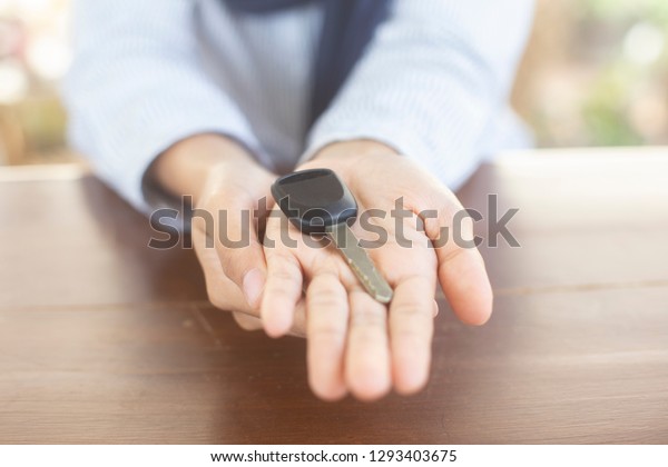 Woman holding\
car keys in hand, concept: service Rent or purchase of auto ,Secure\
electronic remote control program,Successful gifts to vehicles,sale\
insurance auto\
dealership\
