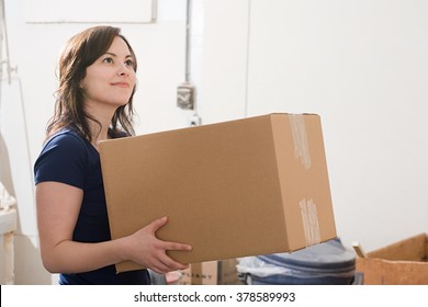 Woman Holding A Cardboard Box