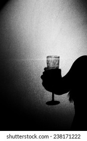 Woman Holding A Champange Glass On Black Background