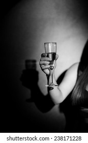 Woman Holding A Champange Glass On Black Background