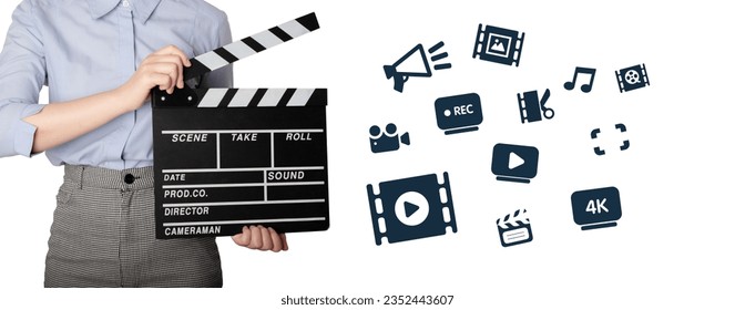 Woman holding Clapperboard or movie slate use in video production ,film, cinema industry. The hand is holding clapper board or movie slate. Hands Holding a Film Slate Directing a Movie Scene.  - Shutterstock ID 2352443607