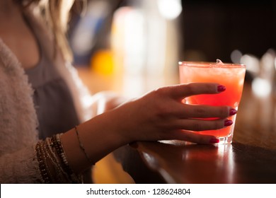 Woman Holding A Cocktail Glass