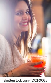 Woman Holding A Cocktail Glass