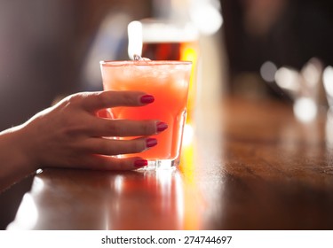 Woman Holding A Cocktail Glass