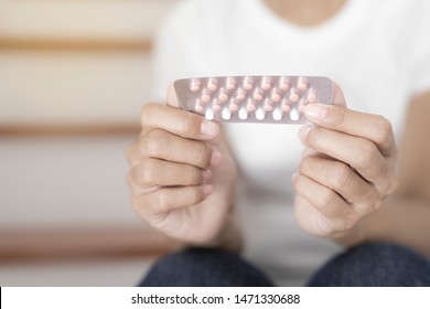 Woman Holding Combined Oral Contraceptive Pill.Gynecology Concept.